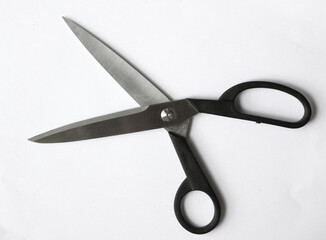 Scissors hand-operated cutting instruments. Scissors for cutting paper and thin materials, object is isolated on white background . 