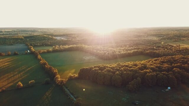 Drone HD Video of the Golden Hour Sunset over a Country Farm Forest in Door County Wisconsin