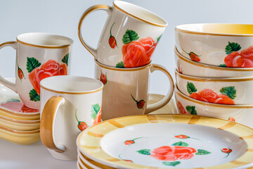 Cups, plates, bowls on white background