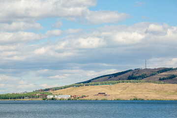 Fototapeta premium Lake among the Ural mountains, cloudy sky