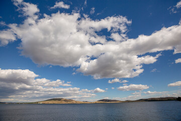 Lake among the Ural mountains, cloudy sky