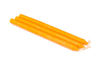 Yellow candles isolated on a white background.