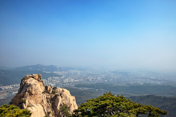 Fototapeta na wymiar View on Seoul from Jaunbong Peak in Bukhansan National Park, Korea