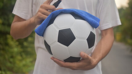 People use alcohol spray cleaning football soccer 