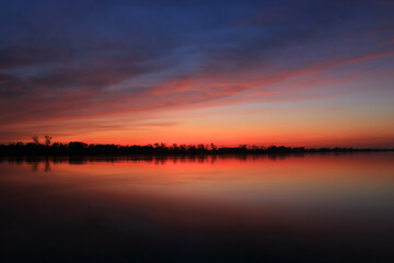 Fototapeta na wymiar Colorful sunset by the Odra River, Poland.