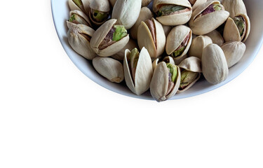 Pistachio nut in bowl isolated on white background.top view for copy space.