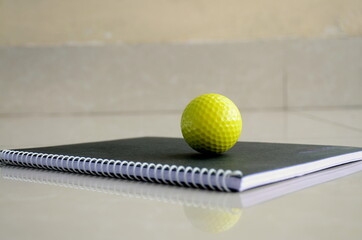 Golf Ball on a black background. Quarantine Photography. Abstract, Background wallpaper colourful.