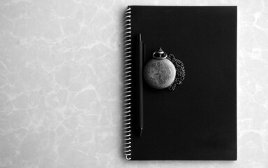Dhaka, Bangladesh - April 25, 2020: A fashionable pocket watch with a golden chain in black background. Happy home photography during the quarantine. Stay home, stay safe.
