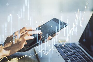 Abstract creative financial graph with finger clicks on a digital tablet on background, forex and investment concept. Multiexposure