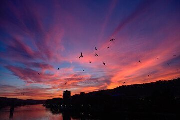 Amazing red sunset and Rhone river in Vienne, France