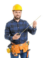 Male worker with tape measure on white background