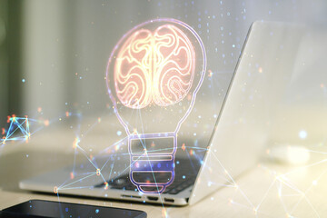 Creative idea concept with light bulb and human brain illustration on modern laptop background....