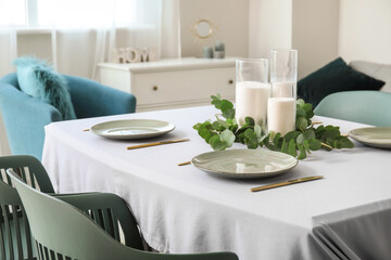 Fototapeta premium Table set in modern stylish dining room