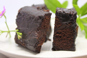 Black forest cake on a white plate.
Delicious black forest created manually.