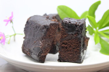 Black forest cake on a white plate.
Delicious black forest created manually.