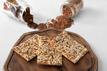 Board with cereal cookies on table