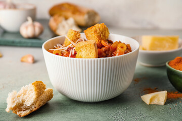 Bowl with tasty pasta and beans on table