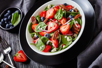 summer salad with berries, nuts, feta cheese