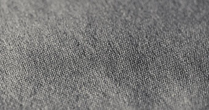 4K Heather Grey Woven Fabric Texture Rotating in Macro, Cinematic Luxury Detail for Clothing Furniture Automobiles