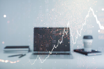 Double exposure of abstract creative financial chart with world map on laptop background, research and strategy concept
