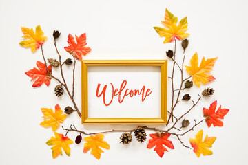 Golden Frame With English Text Welcome. Beautiful, Colorful Autumn Leaf Decoration With Maple Leaf And Fir Cone. White Background