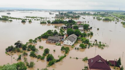 Aerial view Floods and flooded houses. Mass natural disasters and destruction. A big city is flooded after floods and rains.