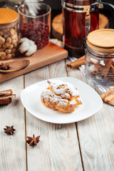 Profiterole sprinkled with powdered sugar