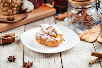 Profiterole sprinkled with powdered sugar