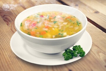 Bowl of delicious vegetable soup on a table