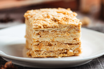 Cake made of thin crispy cakes and cream napoleon