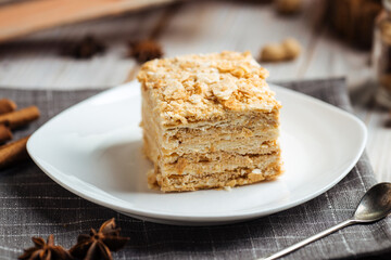 Cake made of thin crispy cakes and cream napoleon