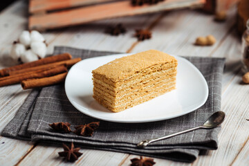 Sweet dessert slice of honey cake on a plate