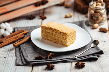 Sweet dessert slice of honey cake on a plate