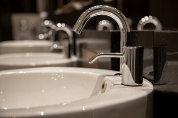 close up of modern stylish washbasin in a public toilet