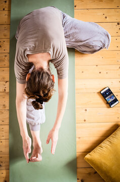 Top View Of Woman Doing Yoga At Home