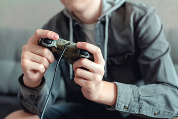 Fototapeta premium teenager playing a game console