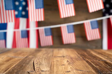 Fototapeta na wymiar Fourth of July. Independence Day concept. American flags on the wooden rustic table.