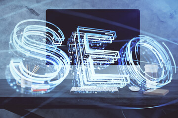 Multi exposure of table with computer and seo drawing hologram. Search optimization concept.