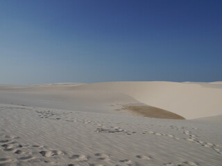 Footprints in the white sand in Brazil