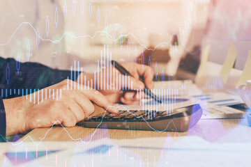 Fototapeta premium Financial trading graph multi exposure with man desktop background.