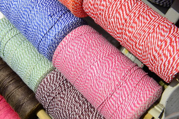 Colorful yarn on spool, yarn on tube, cotton, wool, linen thread