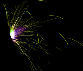 long sparks of fire on a black background