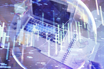 Double exposure of hands and notepad with business icons.