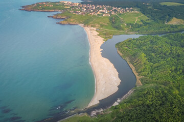 Fototapeta na wymiar Aerial view of Mouth of Veleka Beach near Sinemorets, Black sea, Bulgaria. Picturesque deserted beach in the spring, one of the most romantic beaches in Bulgaria. River flows into the sea 