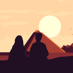 a couple of lovers sitting at dusk facing the pyramid