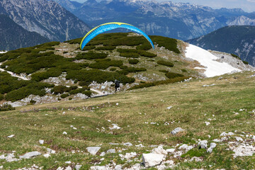 A paraglider at the start of the Krippenstein mountain in the Dachstein Mountains. Salzkammergut....