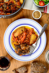 beef plate with carrots on a old wooden table