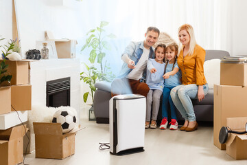 family with an air purifier moving to a new apartment