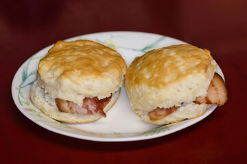 yum, two breakfast biscuits containing bacon strips