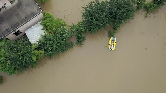 Flooded neighborhood street. Major flooding leaves city, underwater, entire community. Homes, houses overflowing water, insurance needed. Rescue teams helping people Ivano-frankivsk Galych, Ukraine